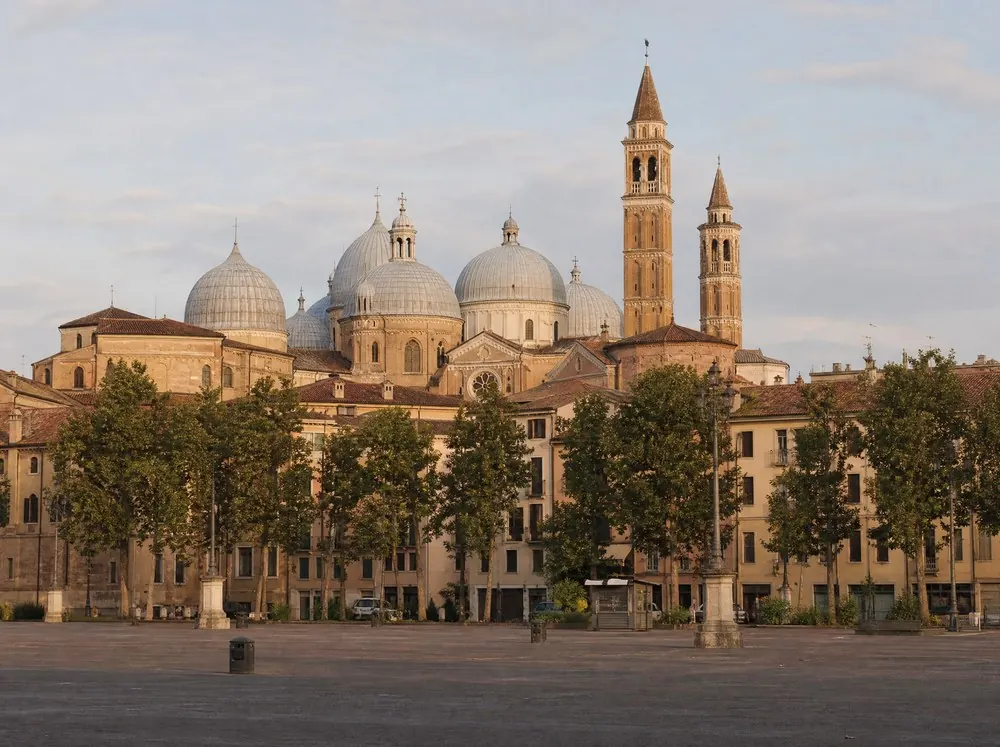Pale domes and brick bell towers above city rooftops