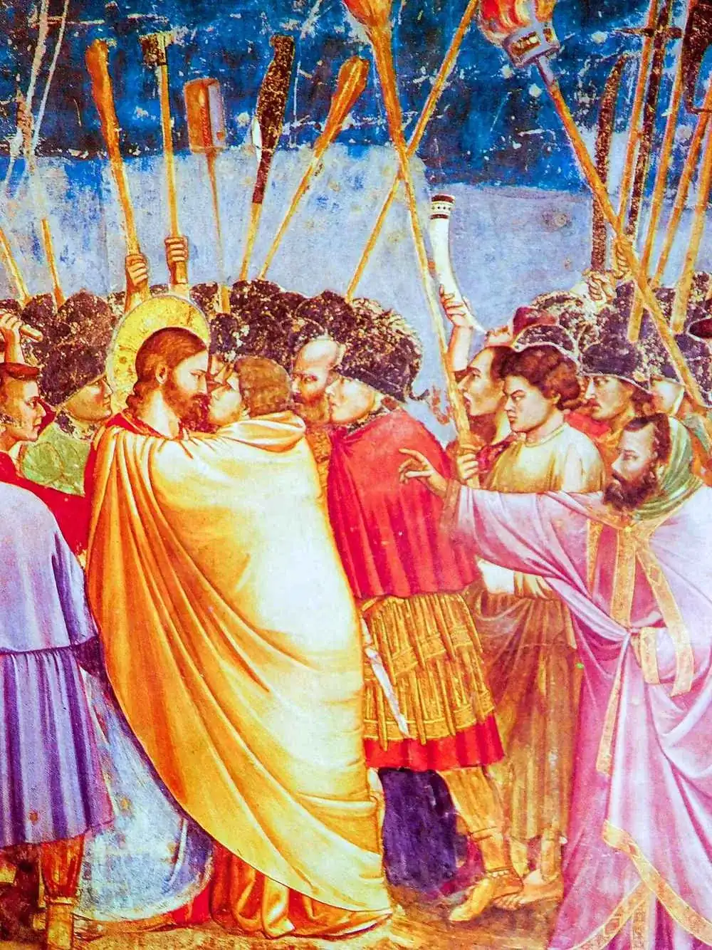 The Kiss of Judas: Judas throwing his cloak round Christ, their faces almost touching, staves and torches behind